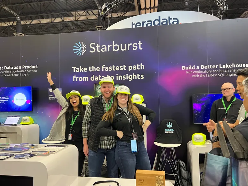 Monica in an orange blazer in front of a reflection pool